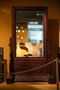A Chinese wooden mirror in the Skušek Collection, <!--LINK'" 0:52-->.