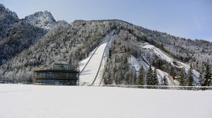 A newly-constructed pavilion opened in 2016 houses also a <!--LINK'" 0:86-->. In the background, on the left side the 'Gorišek Brothers Ski Flying Hill' built in 1969, while the 'Bloudek Giant' is seen on the right-hand side. The latter was finished in 1934, when it also claimed its first world record.