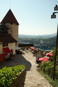 View looking down into the lower courtyard, showing castle outbuildings at <!--LINK'" 0:88-->, the tower now holds the Castle printing works 2010