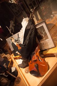 An autograph of Stefan Milenković, a Serbian child prodigy and famous concert violinist, his first violin and a frock coat. Part of the Philographic Collection of the <!--LINK'" 0:220--> at Ana's Mansion, 2012