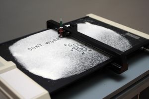 <i>Nanoplotter</i> uses a plotter, an obsolete printing machine from the 1980s, adapted to an uncommon operation. By the artist collective <!--LINK'" 0:277--> at the <i><!--LINK'" 0:278--></i>, <!--LINK'" 0:279-->, Ljubljana, 2010.